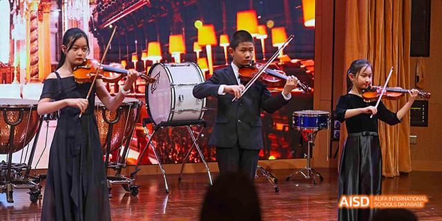 A student band performing on stage at Beijing 21st Century School.