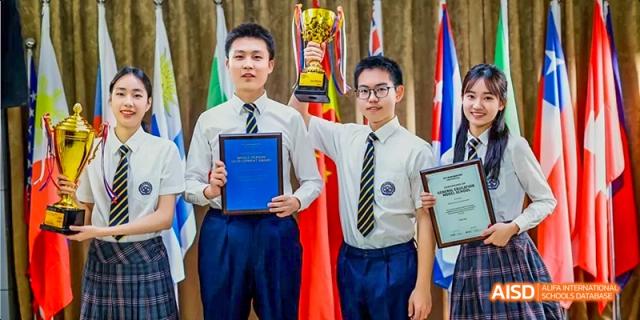 Students holding trophies and smiling at Beijing 21st Century School.