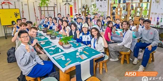A group of students are posing for a group photo in a classroom at Beijing 101 Middle School.