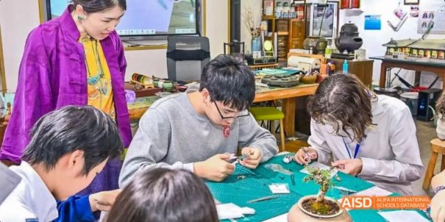 A teacher is instructing students in a lab or a kitchen at Beijing 101 Middle School.
