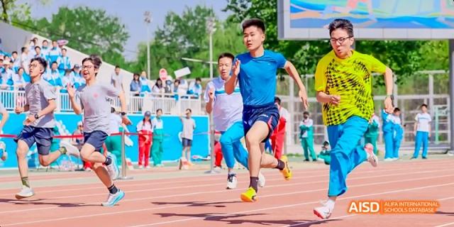 A male student is running a race on a sports track, looking determined at Beijing 101 Middle School.
