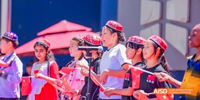 A photo showing a group of students participating in an event, at Beijing Enlighten School.
