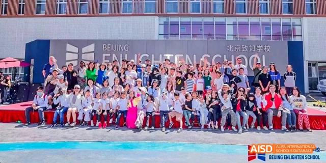 A photo showing students standing in a stadium, at Beijing Enlighten School.
