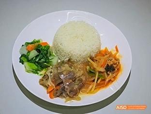 A photo showing a plate of healthy food, at Beijing Enlighten School.