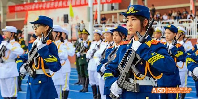 A close-up of a student from Beijing Haidian Foreign Language Academy in a marching band uniform.