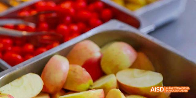 A close-up of sliced fruits from the cafeteria of Beijing Haidian Foreign Language Academy.