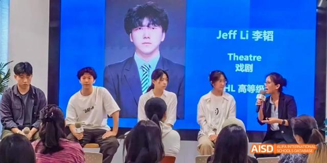 A group of students and an adult sitting in front of a presentation screen with a speaker named Jeff Li at Beijing International Bilingual Academy.