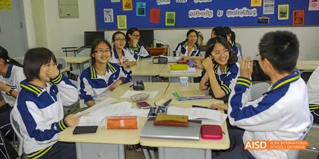 Students from Beijing National Day School International Department seated at desks in a classroom.