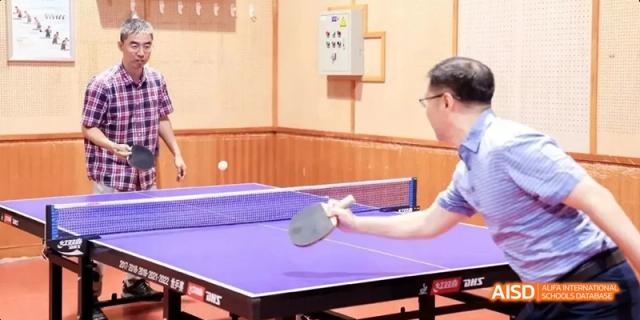 A student from Beijing National Day School International Department playing table tennis.