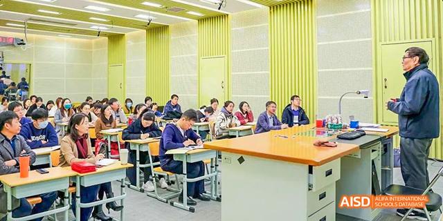 Students from Beilu Academy, working on a project in a bright classroom with yellow and green curtains.