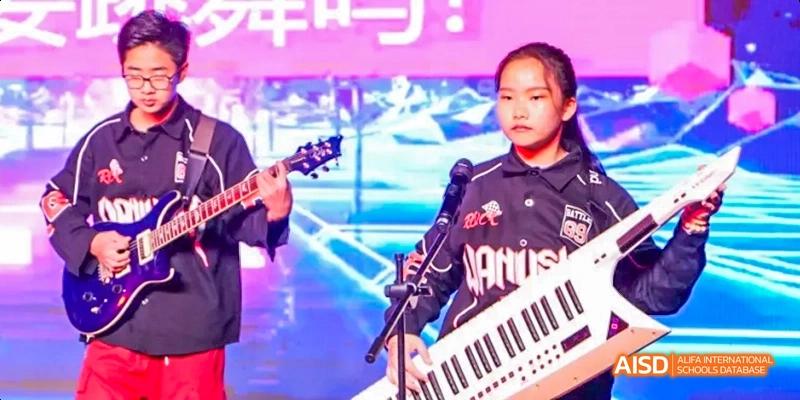 Camford Royal School student playing keytar during a school music event