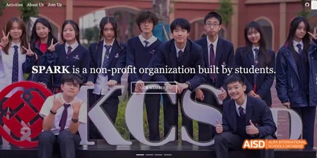 Close-up of a sign with the letters "KCS" on the school building at Dipont KCS Chengdu.