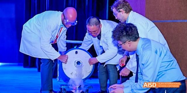Students and a teacher working on a science project at Dipont KCS Chengdu.