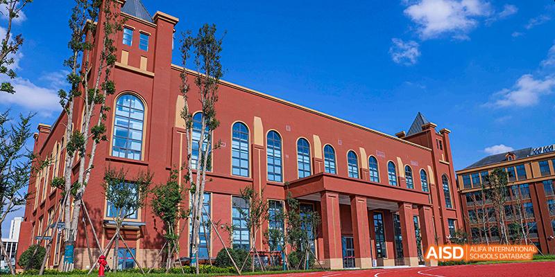 A close-up of a modern building on the campus of Dipont KCS Chengdu.
