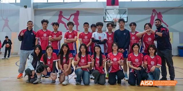 A Dipont KCS Chengdu sports team wearing matching red jerseys poses for a group photo.