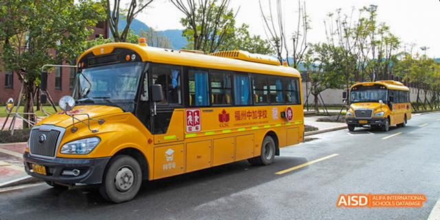 A school bus with the school name written in Chinese on its side at Fuzhou Concord College of Sino-Canada.