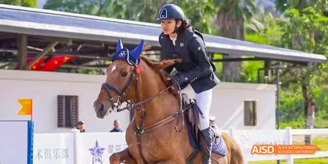 A close-up of a person on a horse during an equestrian event at Fuzhou Concord College of Sino-Canada.