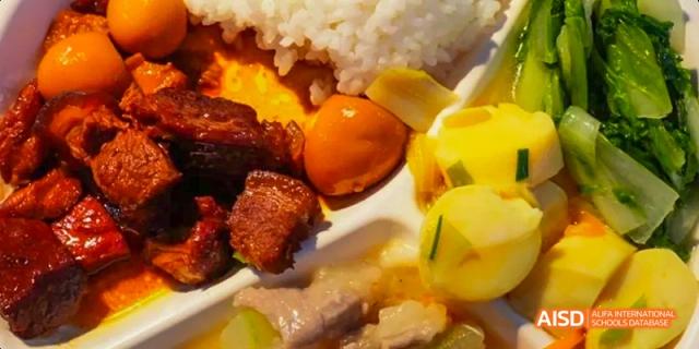 Fuzhou Concord College of Sino-Canada student lunch plate with rice, meat, and vegetables
