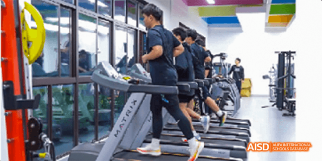 Fuzhou Concord College of Sino-Canada students running on treadmills in a gym