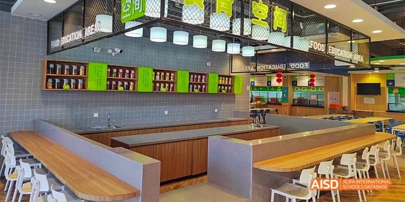 A modern, clean cafeteria kitchen and serving area at HAIDE Bilingual School Dongguan.