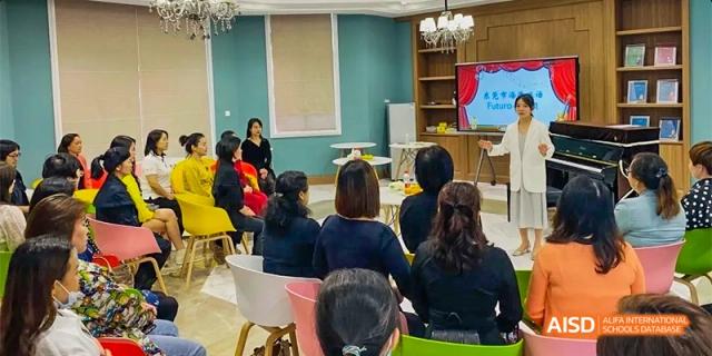 An audience of parents and students from HAIDE Bilingual School Dongguan seated in chairs, watching a presentation in a classroom.