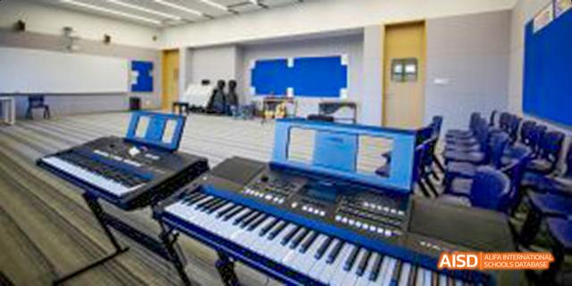 A digital piano or keyboard is seen in a music room at Harrow LiDe School Haikou.