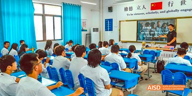 Hefei Thomas School students sitting in a classroom, listening to a lecture.