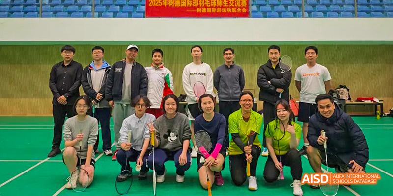 A group photo of students and teachers from the International Department of Chengdu Shude High School after a badminton activity or competition.