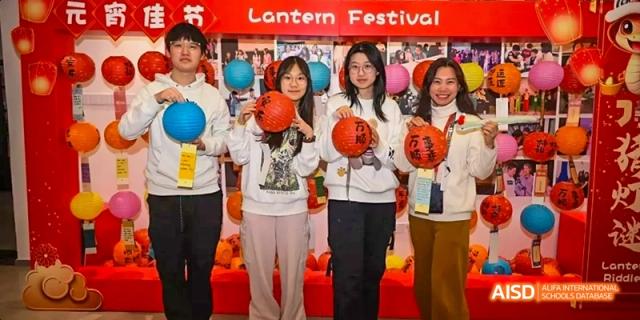 Students and teachers from JPED Academy, posing for a photo with lanterns and basketballs during the Lantern Festival.