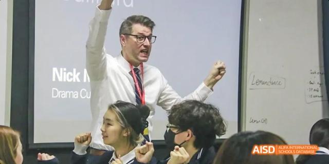 A teacher leading a discussion with students in a classroom, Léman International School Chengdu