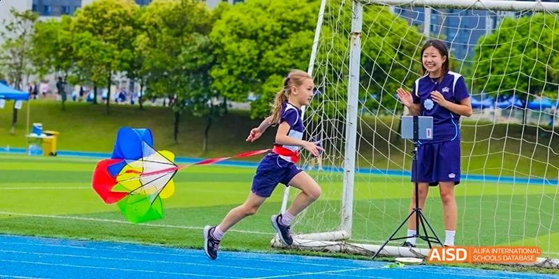 A young girl running a race on a sports track, Léman International School Chengdu