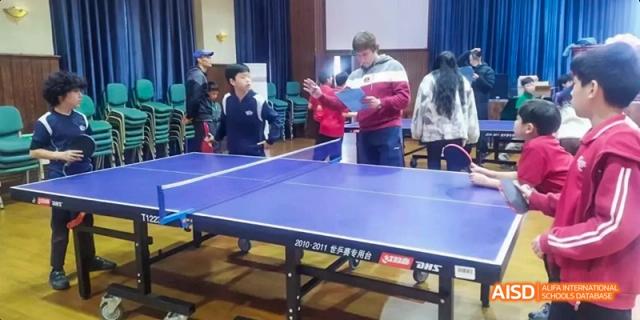 Students playing a game of table tennis, Léman International School Chengdu