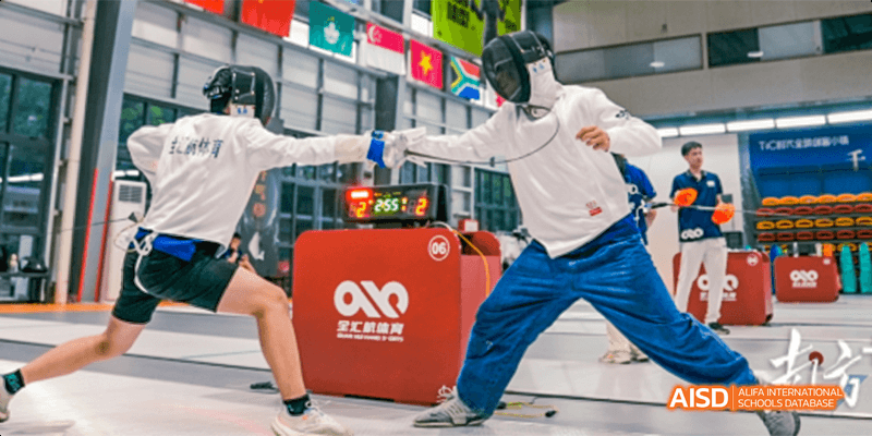 A student participating in a curling-like sport with a red box on a shiny floor at Majestic International College.