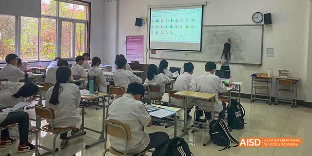Students sitting at their desks in a classroom at Maple Leaf International School - Luoyang.