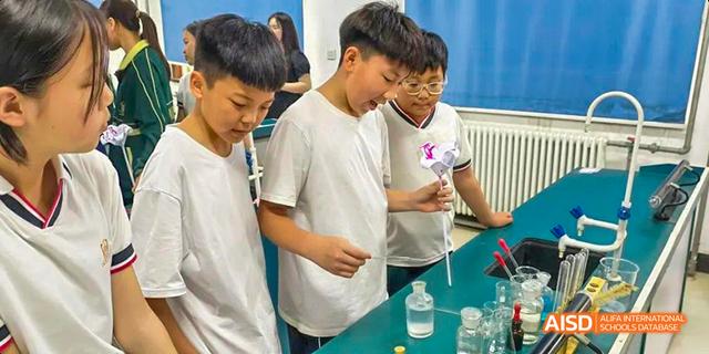 Students participating in a science experiment at Maple Leaf International School - Luoyang.
