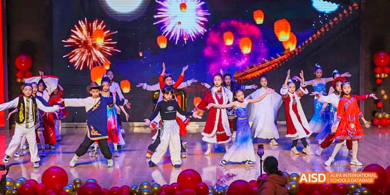 Students performing a dance on stage at Maple Leaf International School - Luoyang.