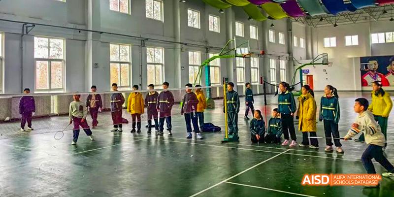 Students playing a game indoors at Maple Leaf International School - Luoyang.