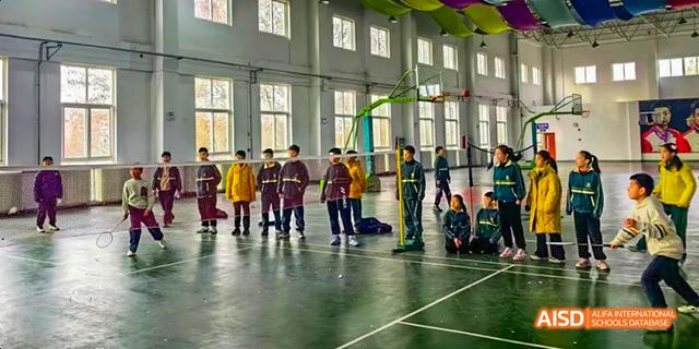 Students playing a game indoors at Maple Leaf International School - Luoyang.