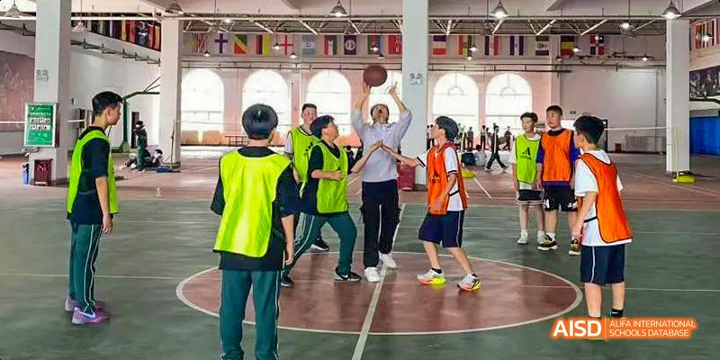 Students playing an indoor sport at Maple Leaf International School - Luoyang.