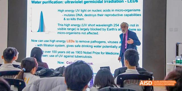 A screen displaying information about "ultraviolet germicidal irradiation" during a class at Beijing Aidi School.