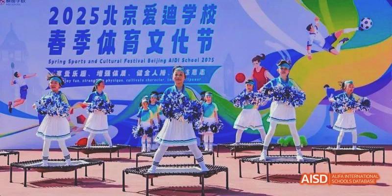 Students performing a dance routine on stage during the Beijing Aidi School festival.