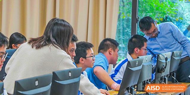 Chengdu Shishi High School Beihu Campus AP Curriculum students collaborating on a project with a teacher.