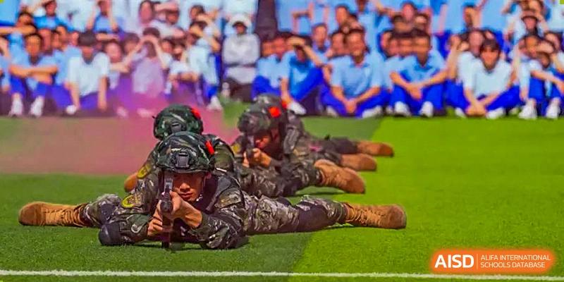 Chengdu Shishi High School Beihu Campus AP Curriculum students undergo military-style training on a field.