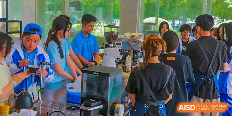 Chengdu Shishi High School Beihu Campus AP Curriculum student receiving training on making coffee in a cafe.