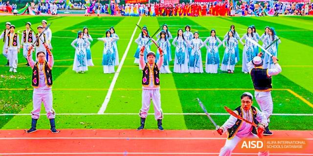 Chengdu Shishi High School Beihu Campus AP Curriculum students performing a traditional dance on a stage.