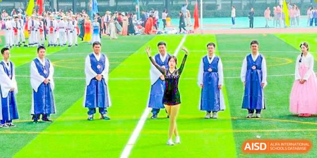 Chengdu Shishi High School Beihu Campus AP Curriculum students performing a dance routine in traditional-looking clothing.