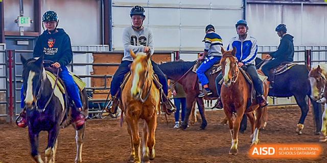 Chengdu Shishi High School Beihu Campus AP Curriculum students riding horses during an activity.