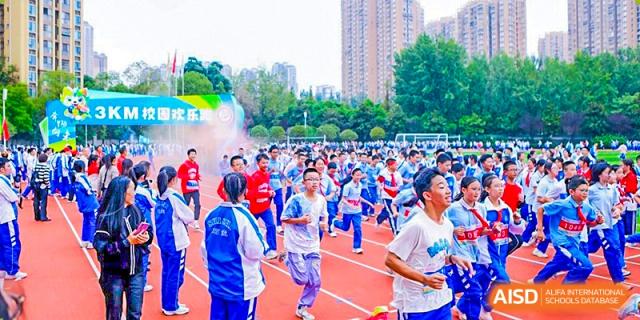 Chengdu Shishi High School Beihu Campus AP Curriculum students participate in a running event on a track.