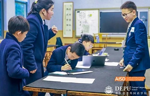 Students writing and working at desks in a classroom at Chongqing Depu Foreign Language School