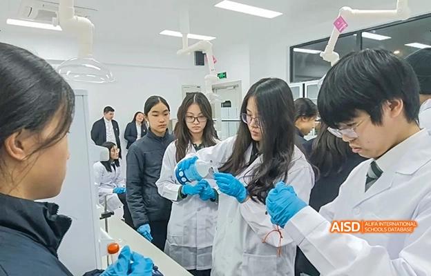 Students in lab coats and gloves working with beakers in a science lab at Chongqing Depu Foreign Language School